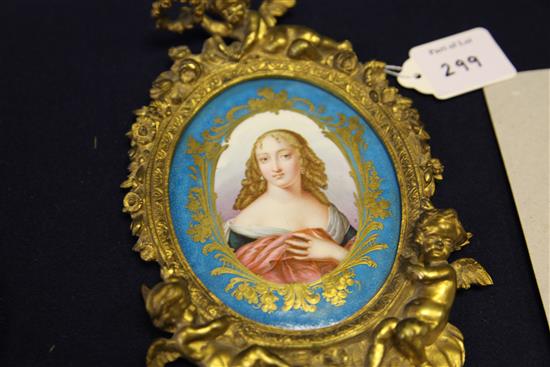 A pair of ormolu mounted Sevres style porcelain wall plaques, late 19th century, 24cm
